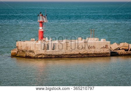 Red Flap Gate Lighthouse In The Port Of Caucasus.