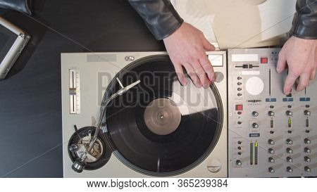 Dj Twists A Record On A Turntable In Slowmotion