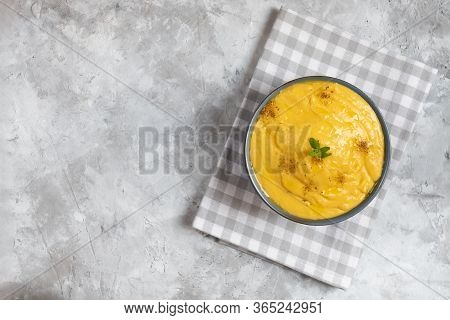 Vegeratian Red Lentil Creamy Soup In A Bowl On Gray Stone Background, Top View