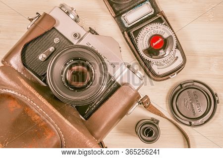 Korolev, Russia - January 07, 2015: Vintage Old Photo-camera In Leather Case With Exposure Meter, Ta