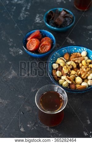 Turkish And Oriental Sweets Dried Dried Apricots, Prunes, Marshmallows, Nuts Lie In A Blue Bowl, And