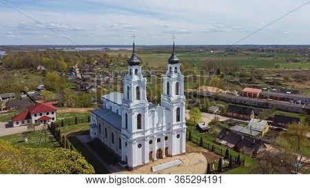 Aerial View Of The Roman Catholic Church In Ludza, Latvia. Sunny Spring Day