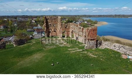 Aerial View Of The Ludza Medieval Castle Ruins On A Hill Between Big Ludza Lake And Small Ludza Lake