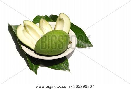 Fresh Mango In A Plate With Leaves Isolated On White Background With Copy Space