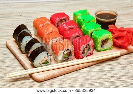Sushi Rolls Set Served On Wooden Tray.