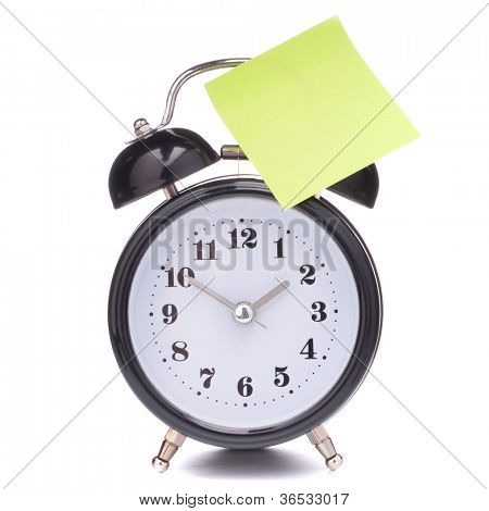 Vækkeur med klistret papir isoleret på hvid baggrund