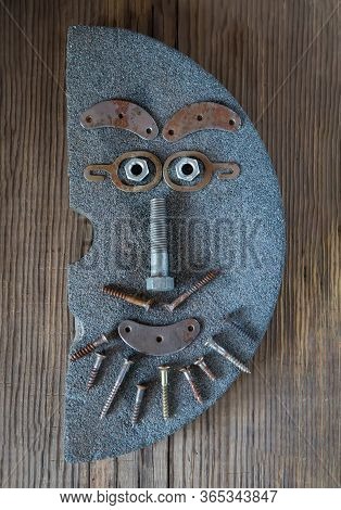 Creative Man's Portrait Is Made From Metal Details: Nails, Bolts, Screws