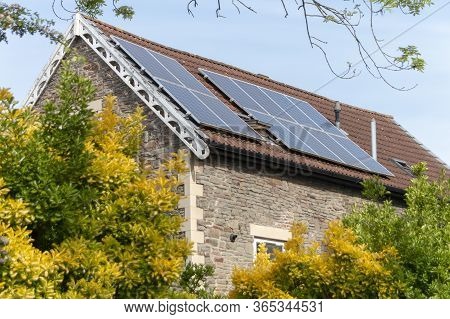 Bristol-may-2020-england-a Close Up View Of Solar Pannels On A Roof Of A Home In Bristol