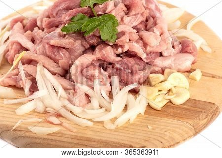 Chopped Pork With Chopped Onions And Garlic, Garnished With Parsley. Chopped Pork On A Cutting Board