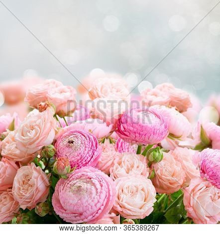 Rose And Rununculus Flowers Bouquet Over Gray Background With Copy Space