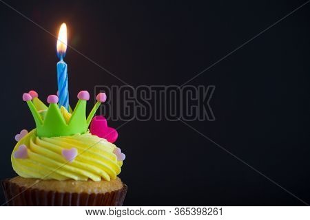 Birthday Cupcake With A Single Blue Candle.cupcake With Yellow Cream And Heart For Love Valentines.g