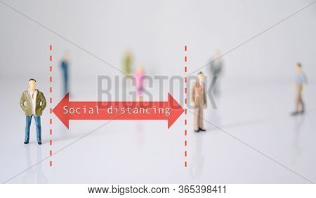 Miniature People With Red Arrow Represent Social Distance Of Coronavirus Or Covid-19 Issue. Social D
