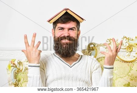 Mad Teacher Concept. Macho Sits With Open Book On Head, Like Roof. Guy, Teacher Overdid With Teachin