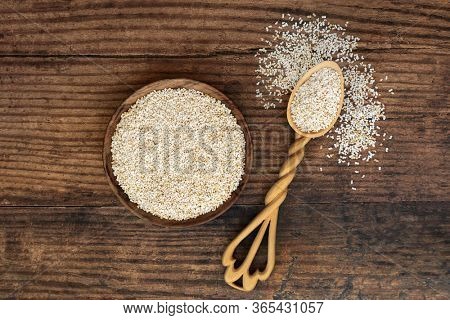 Puffed amaranth grain health food in a bowl and lovespoon. Highly nutritious rich in fibre, antioxidants, calcium, protein & lowers cholesterol & risk of cardiovascular disease. Top view.
