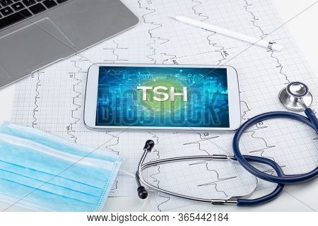 Close-up view of a tablet pc with TSH abbreviation, medical concept