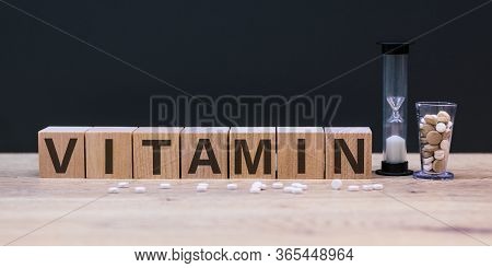 Vitamin Word From Cubes On Background. Vitamins A B C D E, Healthy And Medical Concept.