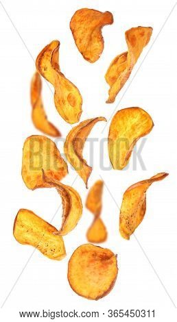 Set Of Falling Sweet Potato Chips On White Background