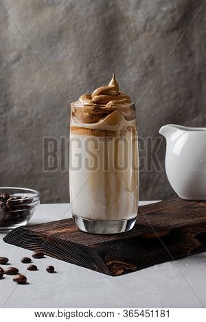 Dalgon Coffee Is A Trendy Drink From Korea. Milk And Juicy Whipped Foam Of Coffee With Sugar In A Gl