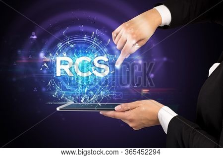 Close-up of a touchscreen with RCS abbreviation, modern technology concept