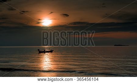 Boats At Achor In The Gulf Of Thailand During A Colorful Sunset