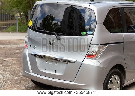 Novosibirsk/ Russia - May 02 2020: Honda Freed, Back View Of Modern Gray Hatchback Parked On Green S