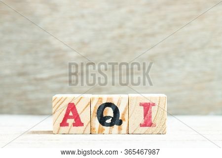 Alphabet Letter In Word Aqi (abbreviation Of Air Quality Index) On Wood Background