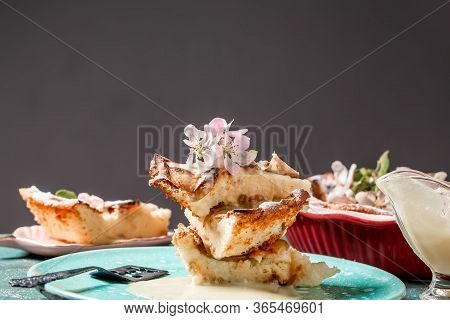 Apple Pie With Cinnamon On The Table, A Piece Of Apple Pie With Condensed Milk. Cake Slices With Pow
