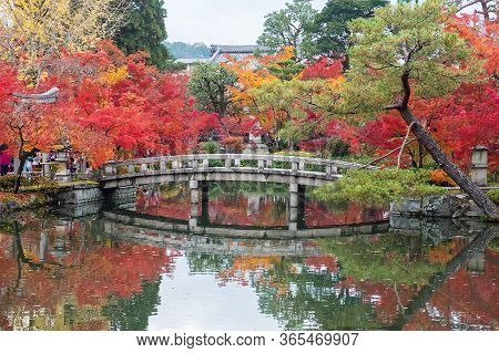 Scenery Stone Bridge And Pond With Colorful Leaves In Eikando Temple, Beautiful Nature Garden In Aut