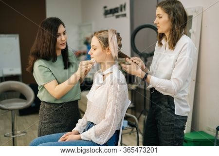 Portrait Of Two Professional Make-up Artist Doing Makeover In Lighting Dressing Room. Concept Of Bac