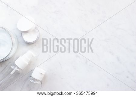 Opened Bottles Of Cream With Empty Pump Bottle Containers Flat Lay On Marble Background Top View Wit