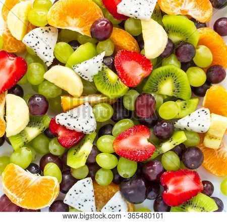 Healthy Fresh Fruit Salad On White Background. Top View.fruit Background