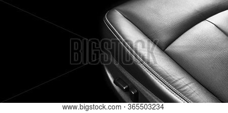 Luxury Car Black Leather Interior. Part Of Leather Car Seat Details With Stitching. Interior Of A Mo