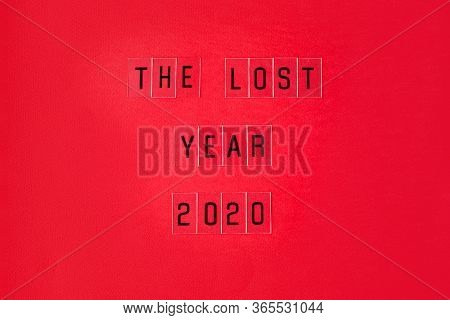 Falling Growth In Business, Composition With The Lost Year 2020 Slogan On Red Paper Background. Flat