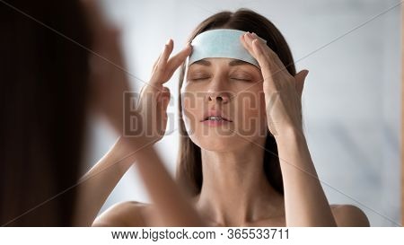 Woman Apply Facial Patches Wrinkle Smoothers For Forehead