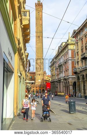 Bologna, Italy - May 9, 2020: Families With Children Wearing The Surgical Masks In Via Rizzoli Road 