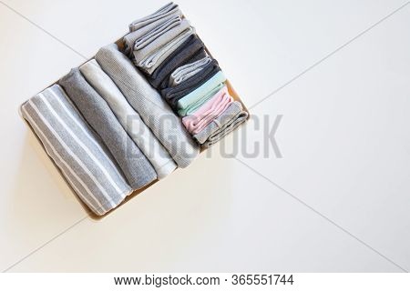 Box With Brught Socks, Closeup. Sort Up Socks. White Background. Basket.