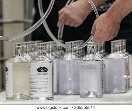 Houston, Tx - March 31, 2020: Empty Glass Bottles At Whitmeyer's Distilling Co. Wait To Be Filled Wi