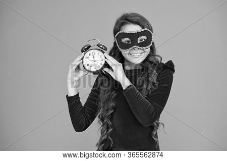 Winter Carnival. Masquerade Concept. Kid Wear Eye Mask. Girl Wear Mask Orange Background. Winter Eve