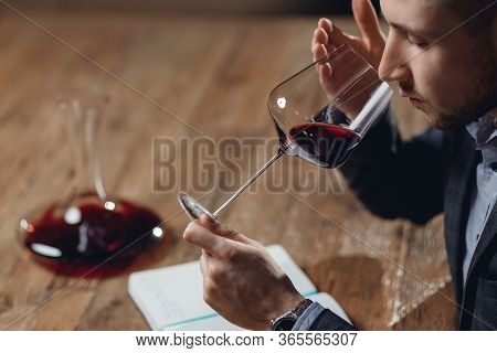 Winemaker Sommelier Man Sniffing Aroma Red Wine In Glass