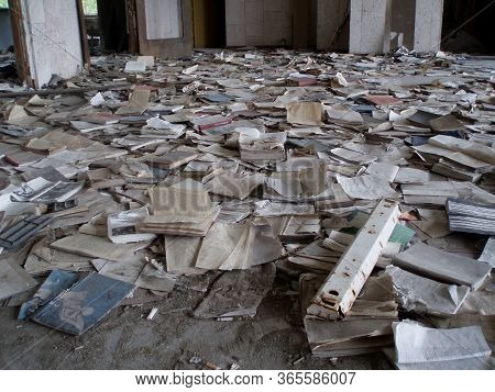 Pripyat, Ukraine - 07.10.2016: Scattered Old Books On The Floor, Abandoned Library In Ghost Town Pri