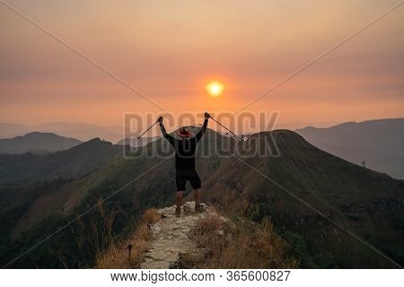 Traveler Man Hiking Enjoying In The Mountains With Backpack At Khao Chang Puak Mountain Thailand