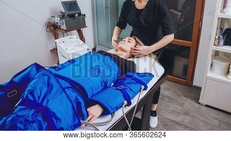 Pressotherapy Machine On Woman In Beauty Center