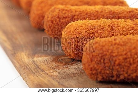 Brown Crusty Dutch Kroketten On A Serving Tray, Selective Focus, Isolated