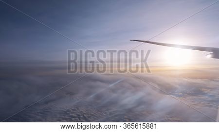 Beautiful Sun On Fantastic Boundless Horizon Over Thick White Clouds Against Vast Blue Sky Under Fly