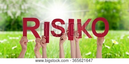 People Hands Holding Word Risiko Means Risk, Grass Meadow