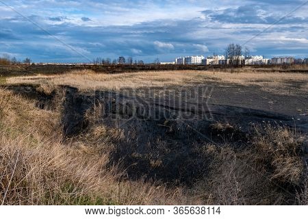 A Deep Ravine On The Outskirts Of The City Of Ivanovo And High-rise Buildings In The Rays Of The Set
