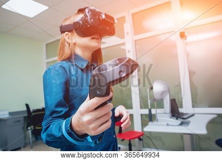 Eye Treatment. Patient In Virtual Reality Goggles. Checking The Girls Vision