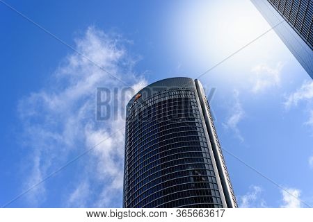 Madrid, Spain - May 10, 2020: Low Angle View Of Office Building In The City Of Madrid Against Blue S