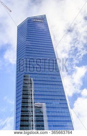 Madrid, Spain - May 10, 2020: Low Angle View Of Office Building In The City Of Madrid Against Blue S