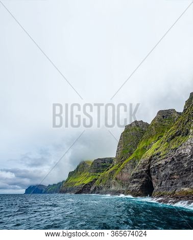 Spectacular Vestmanna Cliffs Near The Ocean With Text Space